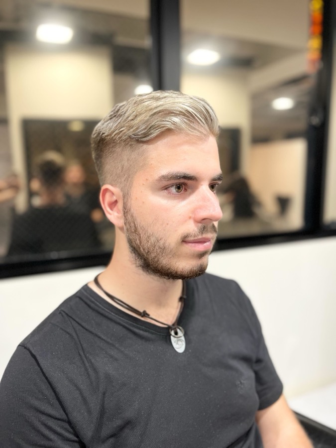Straight hair, styled up with a clean fade
